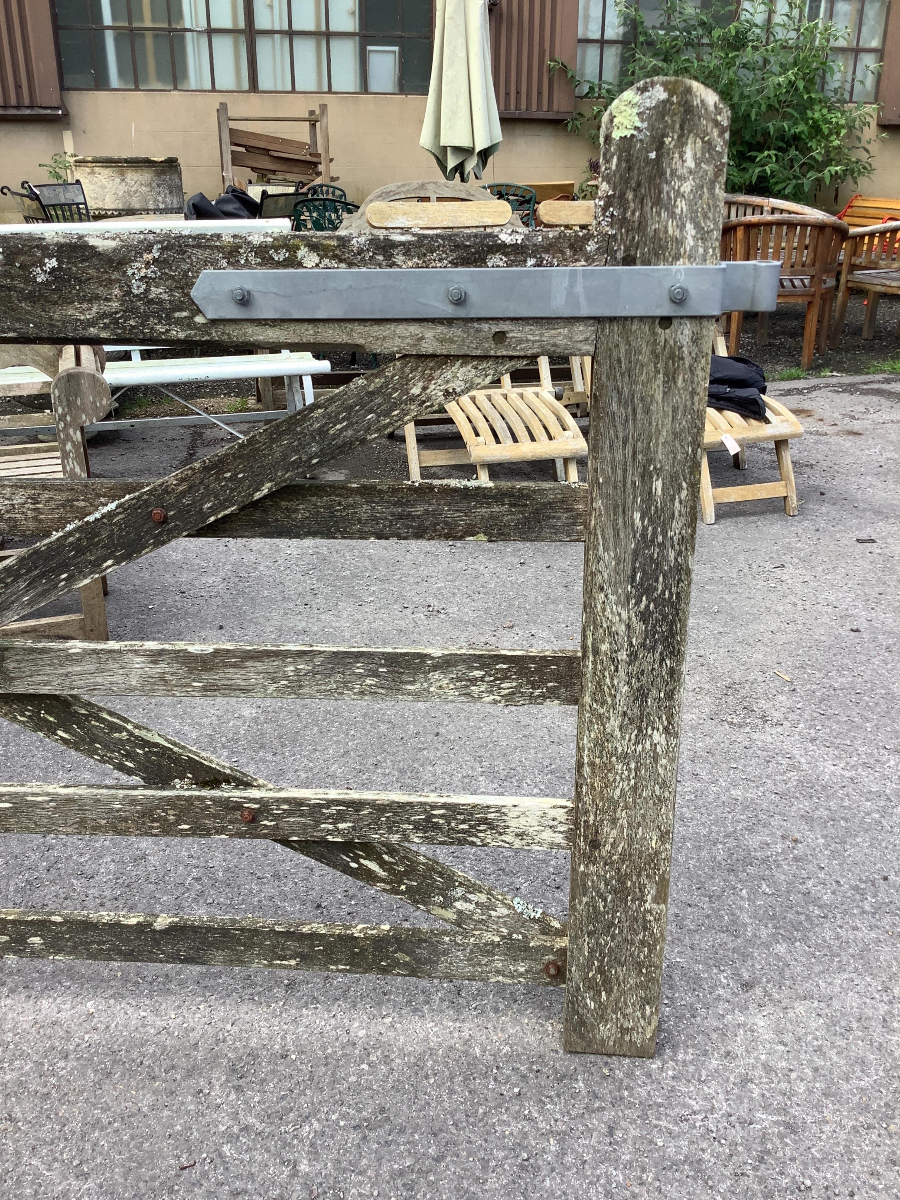 A pair of 12ft Biddenden hardwood gates with galvanised mounts